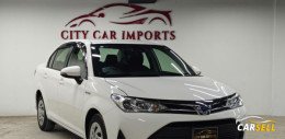 Toyota Axio Hybrid white 2019 Recondition Car